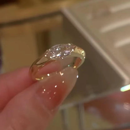 Handcrafted marquise diamond ring—featuring a translucent quality that sparkles brilliantly in sunlight!